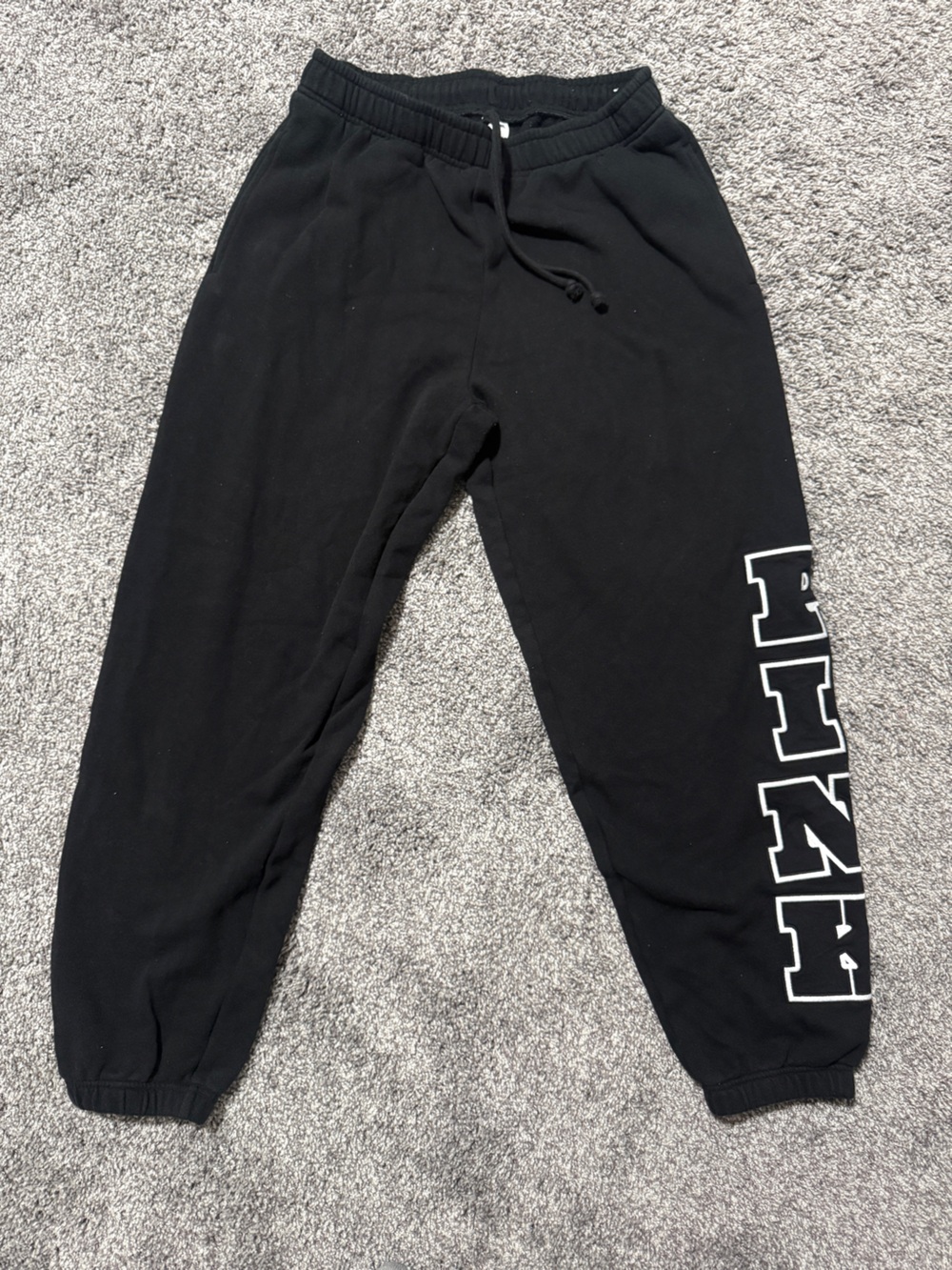 PINK women’s black sweatpants with white embroidered logo